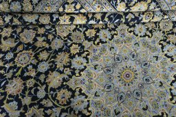 Close-up detail of 2000s Kashan rug from Iran / Persia showing Wool weave