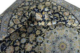 Surface texture of 2000s Kashan rug with natural Wool and intricate pattern