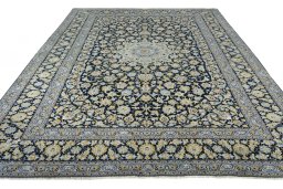 Surface texture of 2000s Kashan rug with natural Wool and intricate pattern