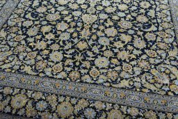 Close-up detail of 2000s Kashan rug from Iran / Persia showing Wool weave