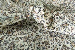 Surface texture of 2000s Kashan rug with natural Wool and intricate pattern