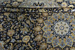 Close-up detail of 2000s Kashan rug from Iran / Persia showing Wool weave