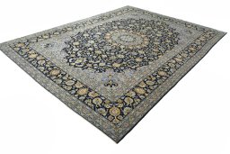 Corner detail of 2000s Kashan rug showing border pattern and Wool pile