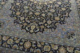 Close-up detail of 2000s Kashan rug from Iran / Persia showing Wool weave