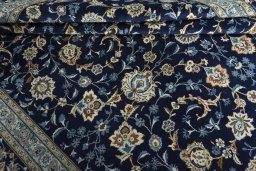 Close-up detail of 2000s Kashan rug from Iran / Persia showing Wool weave