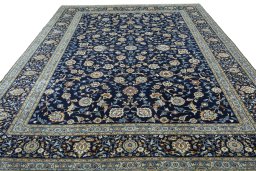 Surface texture of 2000s Kashan rug with natural Wool and intricate pattern