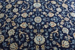 Central medallion detail of 2000s Kashan rug from Iran / Persia
