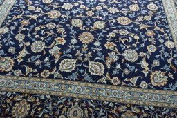 Close-up detail of 2000s Kashan rug from Iran / Persia showing Wool weave