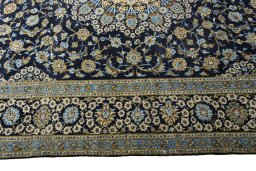 Corner detail of 2000s Kashan rug showing border pattern and Wool pile