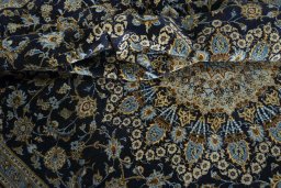 Surface texture of 2000s Kashan rug with natural Wool and intricate pattern