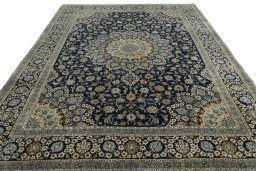 Surface texture of 2000s Kashan rug with natural Wool and intricate pattern