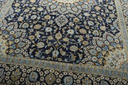 Close-up detail of 2000s Kashan rug from Iran / Persia showing Wool weave