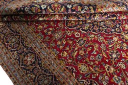 Close-up detail of 2000s Kashan rug from Iran / Persia showing Wool weave