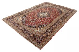 Corner detail of 2000s Kashan rug showing border pattern and Wool pile