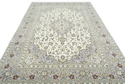 Surface texture of 2000s Kashan rug with natural Wool and intricate pattern