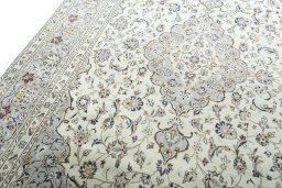 Backside of handmade 2000s Kashan rug showing knot structure and weave density