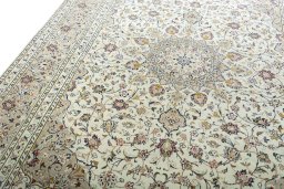 Backside of handmade 2000s Kashan rug showing knot structure and weave density