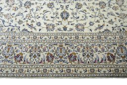Corner detail of New Kashan rug showing border pattern and Wool pile