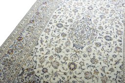 Backside of handmade New Kashan rug showing knot structure and weave density