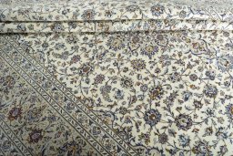 Close-up detail of 2000s Kashan rug from Iran / Persia showing Wool weave