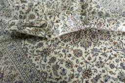 Surface texture of 2000s Kashan rug with natural Wool and intricate pattern