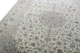 Backside of handmade 2000s Kashan rug showing knot structure and weave density