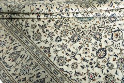 Close-up detail of 2000s Kashan rug from Iran / Persia showing Wool weave
