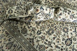 Surface texture of 2000s Kashan rug with natural Wool and intricate pattern