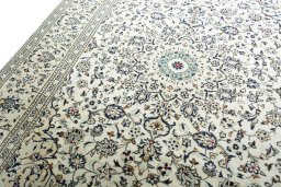 Backside of handmade 2000s Kashan rug showing knot structure and weave density