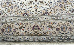Full view of 2000s Kashan rug from Iran / Persia, 300 × 200 cm in Beige tones