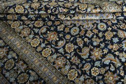 Surface texture of 2000s Kashan rug with natural Wool and intricate pattern