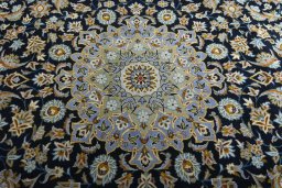 Central medallion detail of 2000s Kashan rug from Iran / Persia