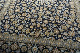 Close-up detail of 2000s Kashan rug from Iran / Persia showing Wool weave