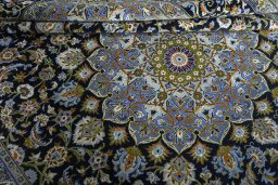 Close-up detail of New Kashan rug from Iran / Persia showing Wool weave