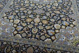 Close-up detail of New Kashan rug from Iran / Persia showing Wool weave
