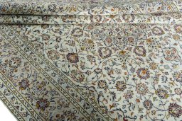 Close-up detail of 2000s Kashan rug from Iran / Persia showing Wool weave