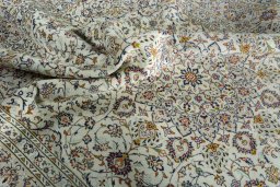 Surface texture of 2000s Kashan rug with natural Wool and intricate pattern