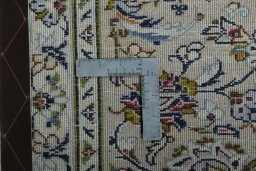 Backside of handmade 2000s Kashan rug showing knot structure and weave density