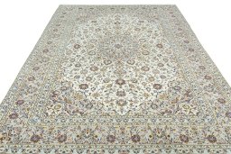 Surface texture of 2000s Kashan rug with natural Wool and intricate pattern