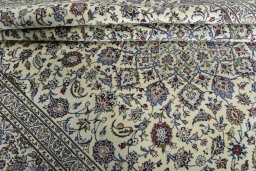 Close-up detail of New Kashan rug from Iran / Persia showing Wool weave