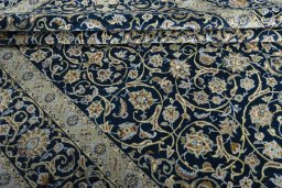 Close-up detail of 2000s Kashan rug from Iran / Persia showing Wool weave