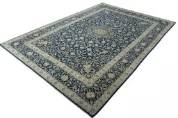 Corner detail of 2000s Kashan rug showing border pattern and Wool pile