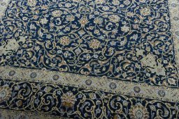 Close-up detail of 2000s Kashan rug from Iran / Persia showing Wool weave