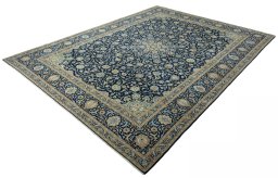 Corner detail of 2000s Kashan rug showing border pattern and Wool pile