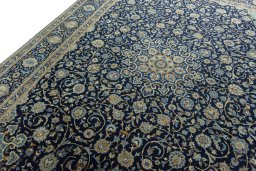 Backside of handmade 2000s Kashan rug showing knot structure and weave density