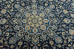Central medallion detail of 2000s Kashan rug from Iran / Persia