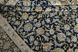 Close-up detail of 2000s Kashan rug from Iran / Persia showing Wool weave