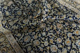 Surface texture of 2000s Kashan rug with natural Wool and intricate pattern