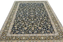 Surface texture of 2000s Kashan rug with natural Wool and intricate pattern