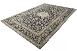 Corner detail of 2000s Kashan rug showing border pattern and Wool pile